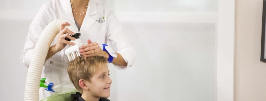 child receiving effective head lice treatment