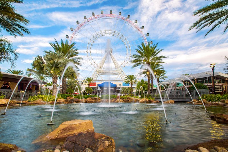 A pond and Ferris wheel in Orlando