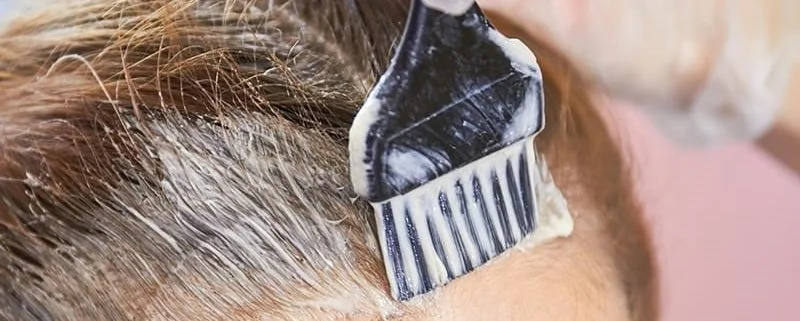 hair dye being applied to kill head lice